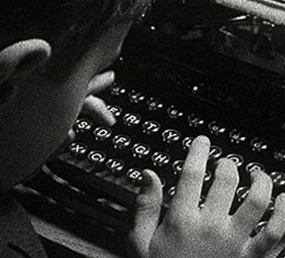 Young Boy at Typewriter